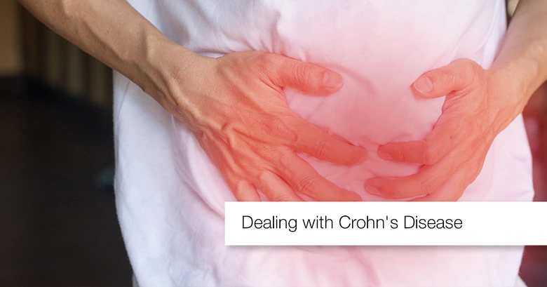 Person holding stomach in pain