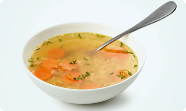 Vegetable soup bowl with spoon