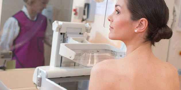 Woman at mammography machine