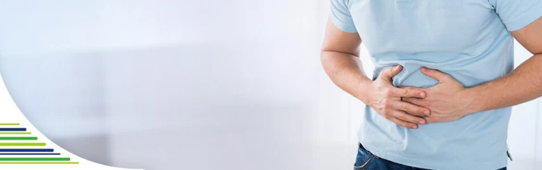 Man holding stomach in pain