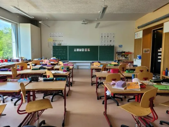 Empty classroom with desks and chairs