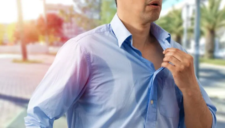 Man sweating in shirt
